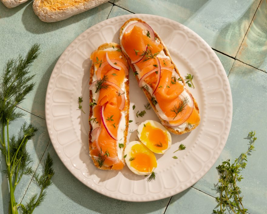 Open French bread topped with salmon and egg