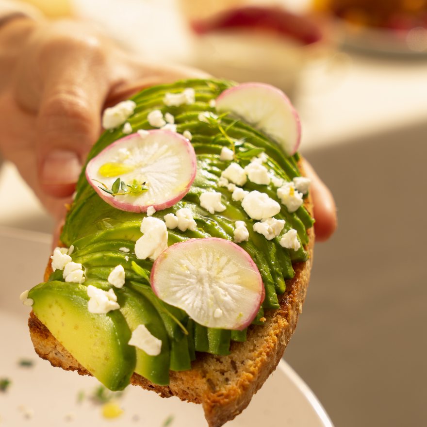 Sliced seeded bread on a wooden board